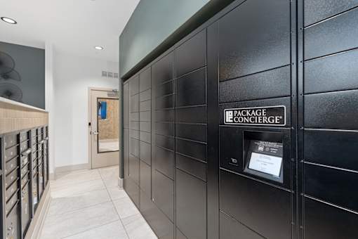 A black locker room with a sign that says "Package Concierge".