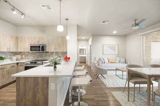A modern kitchen with a white island and wooden cabinets.