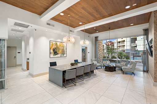 A modern office space with a reception desk and a view of the city.