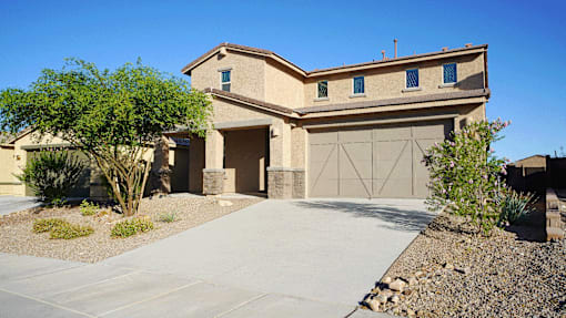 A house with a garage and a driveway.