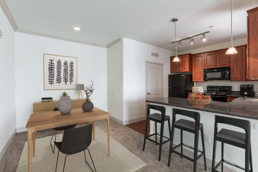 a kitchen and dining area in a 555 waverly unit