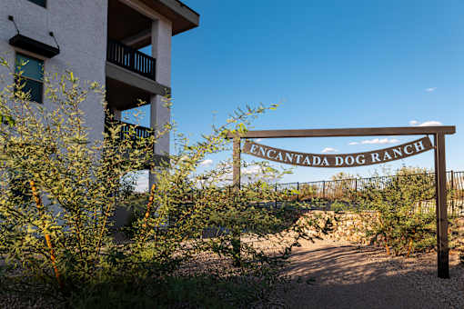 A sign that says Cantada Dog Ranch in front of a building.
