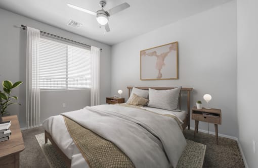 a bedroom with a large bed and a ceiling fan