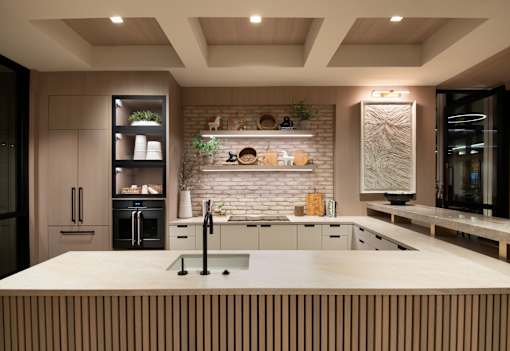 A modern kitchen with a large island and wooden accents.