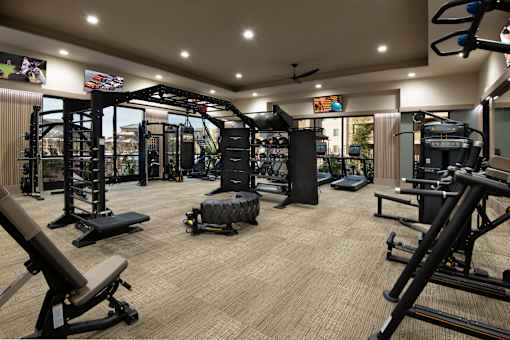 A well-equipped gym with various exercise machines and equipment.