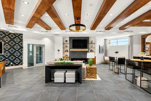 A modern kitchen with a central island and a fireplace.