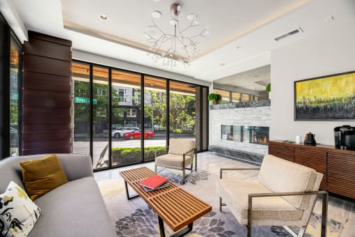 a living room with a couch and a coffee table and a fireplace
