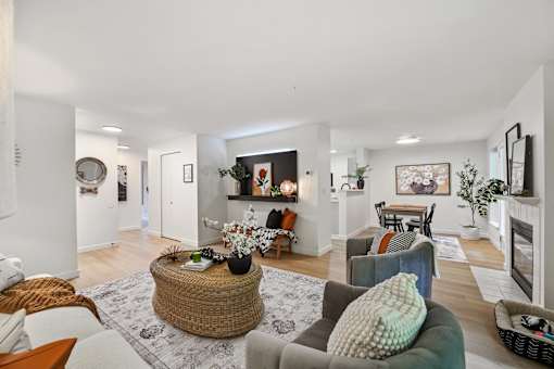 a living room with couches and chairs and a fireplace