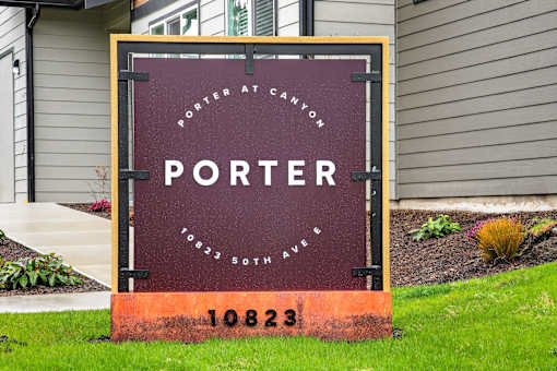 A sign that says Porter at Canyon stands in front of a house.