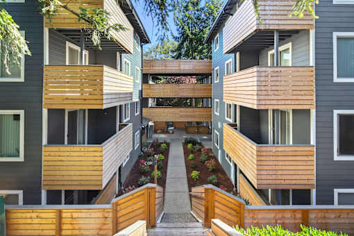 A modern apartment complex with a central courtyard.