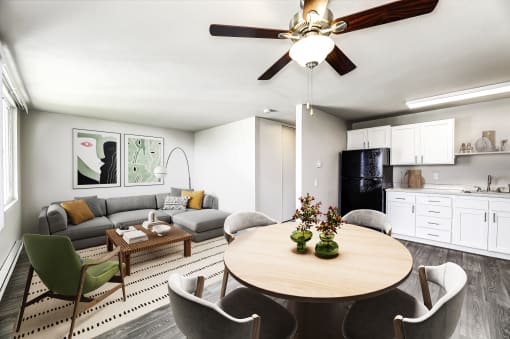 a living and dining area with a ceiling fan and a large window