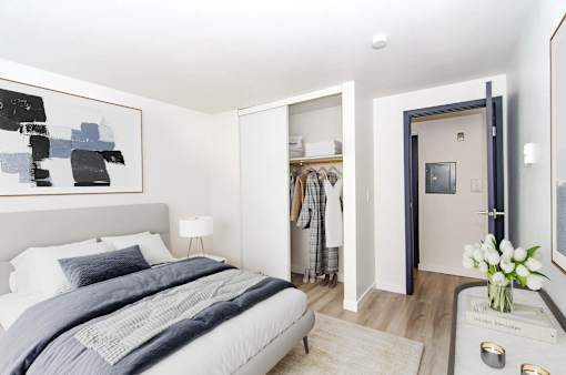 a bedroom with a bed and a closet