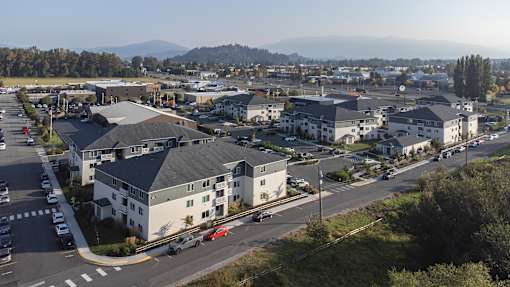 A view of a town with buildings and cars.