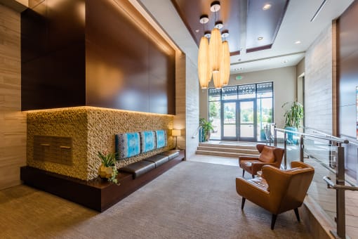 a lobby with a couch and chairs