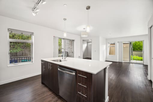 a kitchen with a large island and a large window