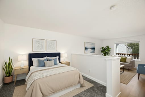 A bedroom with a large bed and a balcony overlooking a patio.