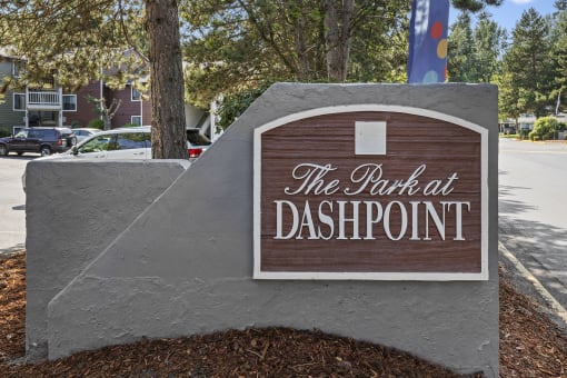 a sign for the park at daspleton on the side of a street