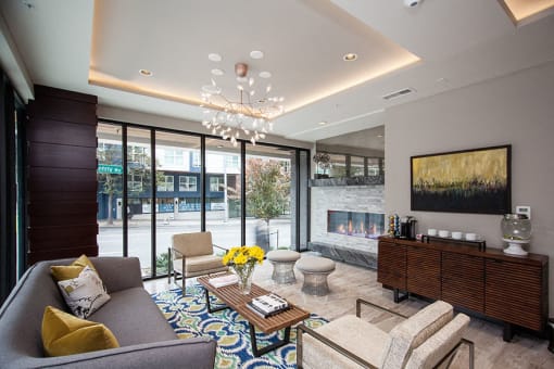 a living room with a fireplace and a large window