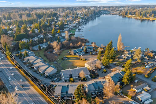 A small town with a large lake in the background.