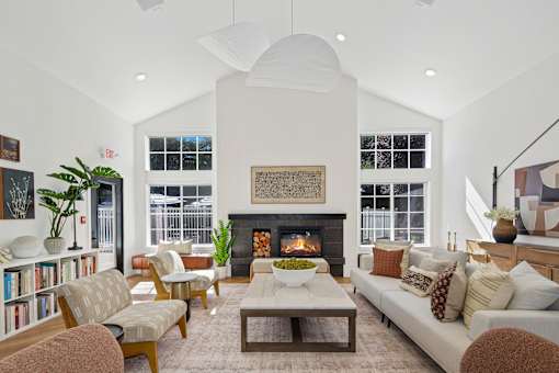 A living room with a fireplace and a couch.