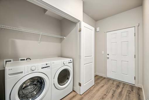 A laundry room with a washer and dryer.
