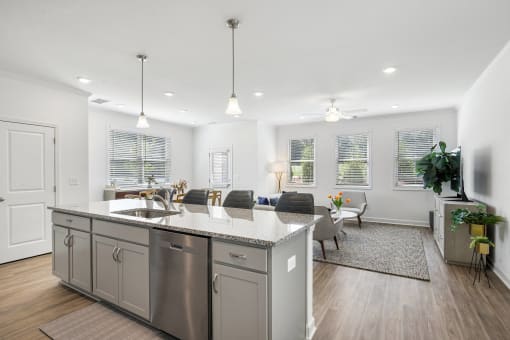 a living room with a kitchen and a dining room