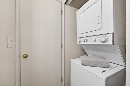 A white oven with a towel on top of it.