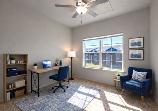 A room with a desk, chair, and a fan.