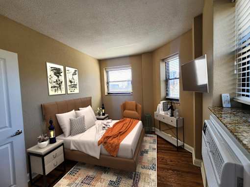 A bedroom with a bed, nightstand, and window.