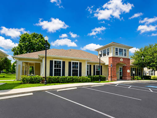 A building with a parking lot in front of it.