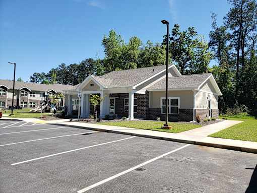 A parking lot with a building in the background.
