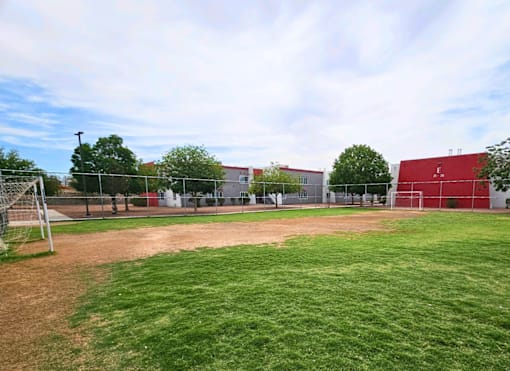 A soccer field with a goal post on the left side.