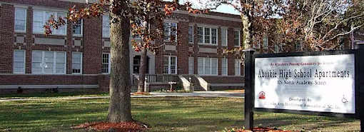 A sign in front of a building that says Aboskie High School Apartments.