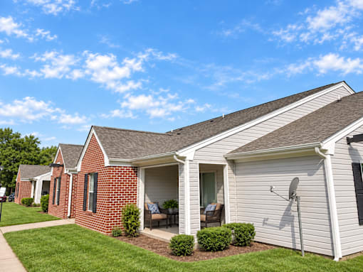 A house with a red brick exterior and a white garage door.