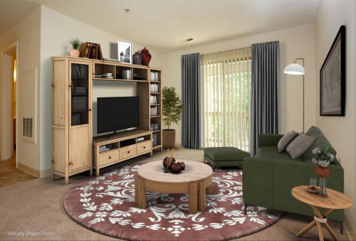 a living room with a green couch and a television