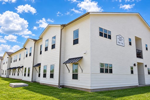 The side of our buildings with covered windows and clear signage
