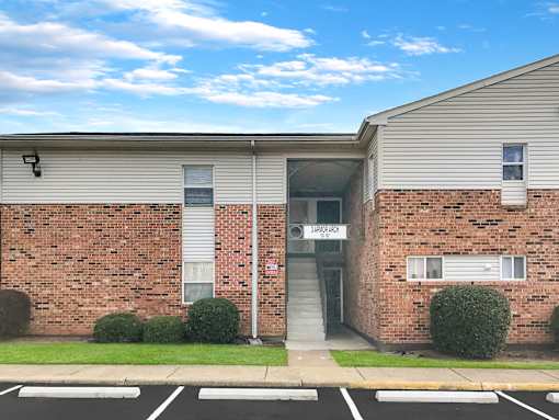 A brick building with a sign that says "LARRY'S" on it.