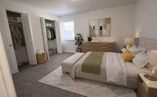 A bedroom with a bed, nightstand, and a wardrobe.