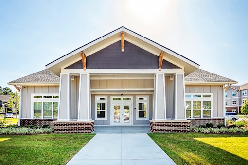 A modern building with a front porch and a covered entrance.