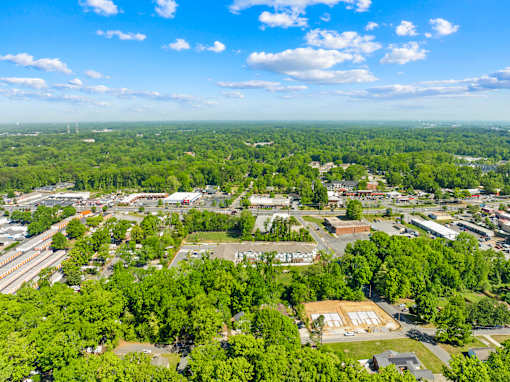 A bird's eye view of a town with buildings and trees.