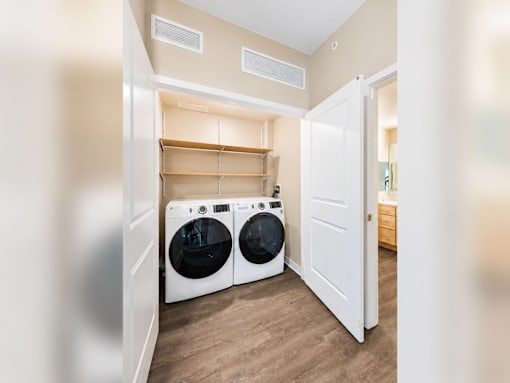A laundry room with a washer and dryer.