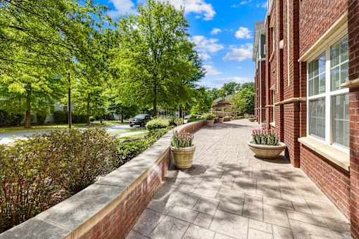 A brick building with a walkway in front of it.
