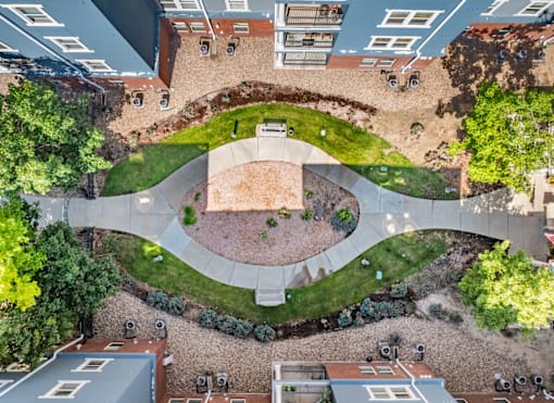 A courtyard surrounded by buildings with a circular design.