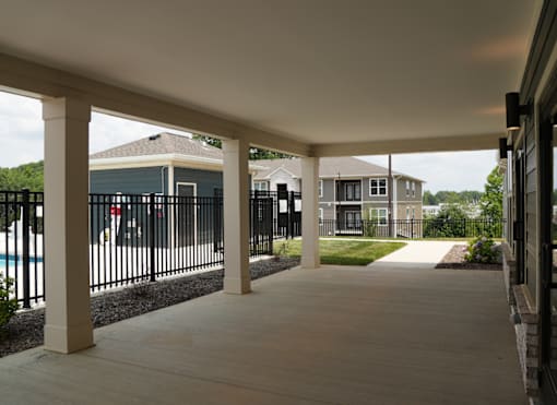 A long covered walkway with pillars on either side.
