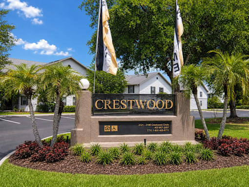 A sign that says Crestwood in front of a building.