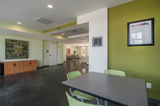 A room with a table and chairs in it.