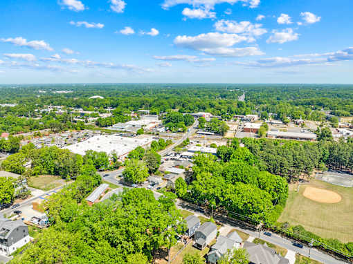 A bird's eye view of a residential area with a baseball field.