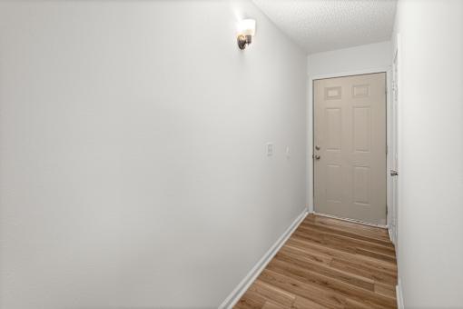 Room with wooden floor at Mammoth at the Orchard Apartments, Rogers, Arkansas