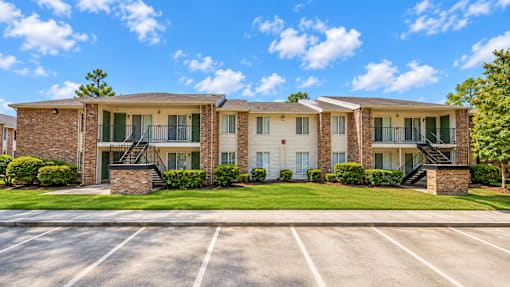 A sunny day at a residential complex with a clear blue sky.