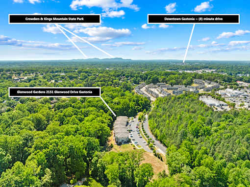 An aerial view of a wooded area with Crowders & Kings Mountain State Park, Glenwood Gardens, and Downtown Gastonia marked.